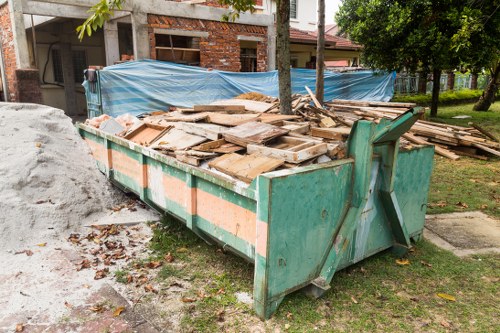Residents disposing of furniture in Heston recycling center